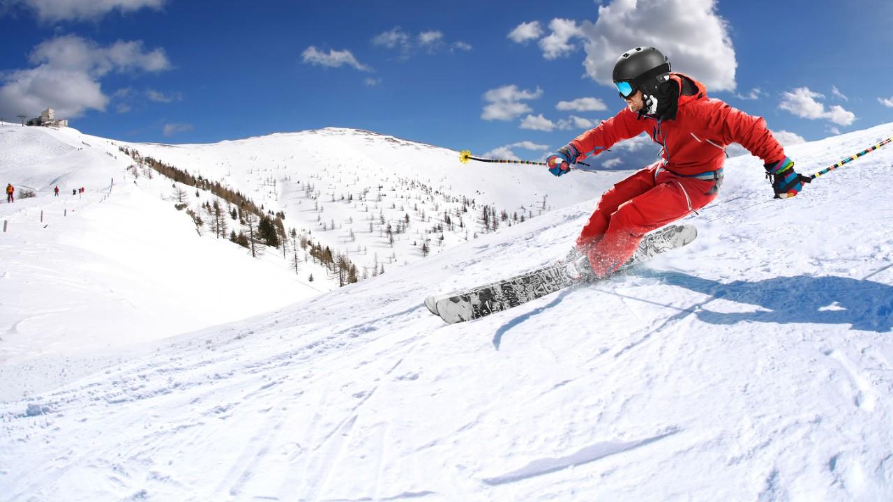 Active man skiing downhill 